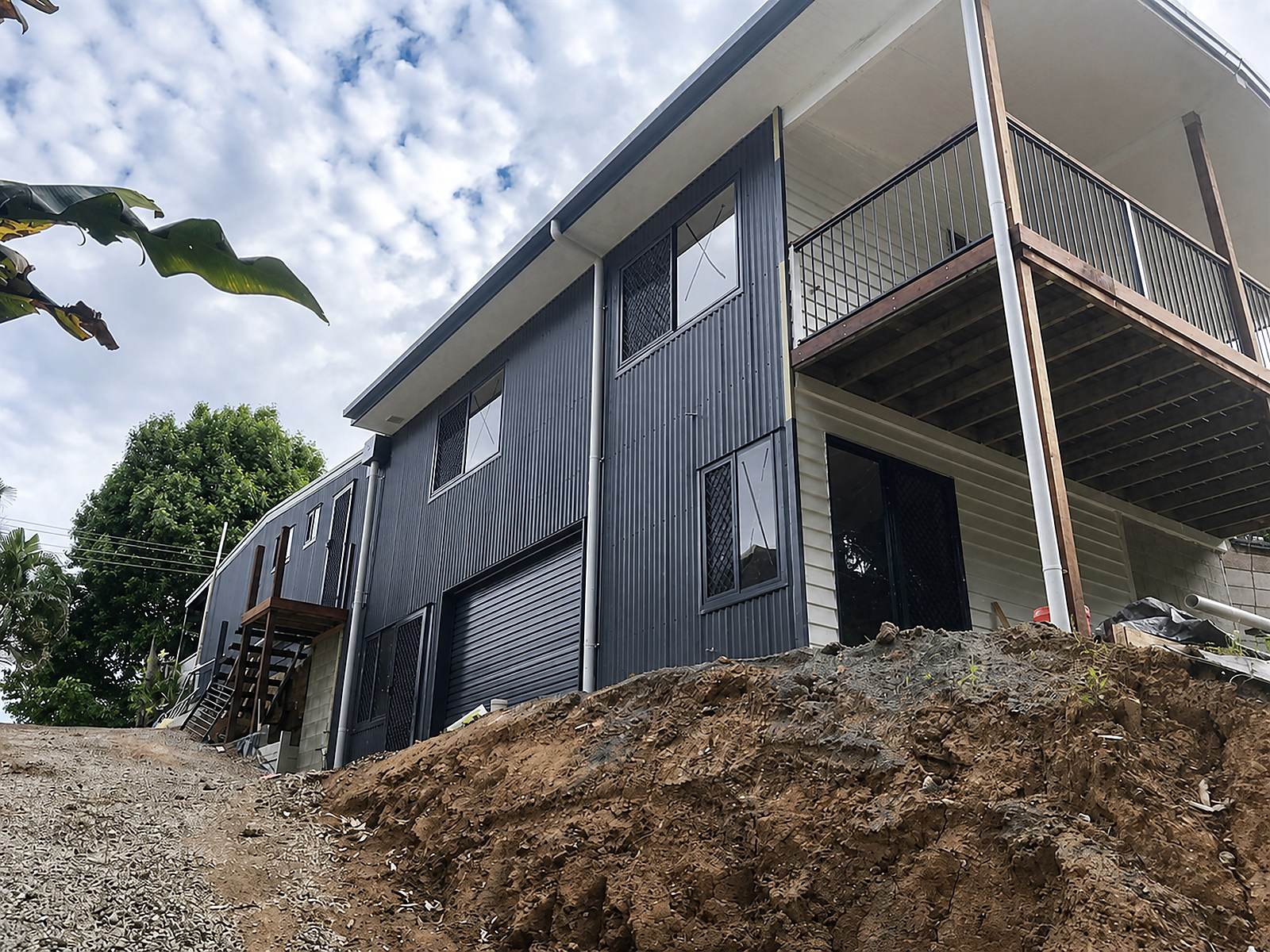 Residential addition during construction on a sloping site.